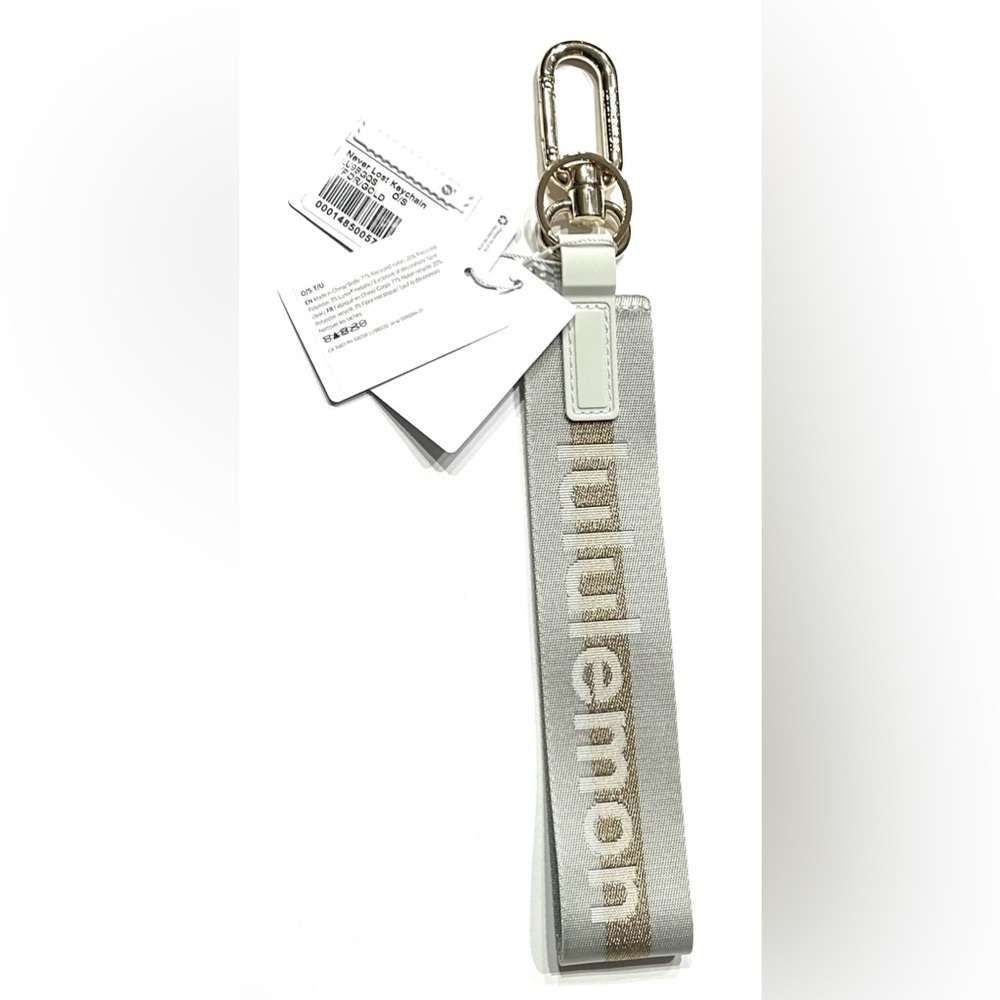 Lululemon Never Lost Keychain Wordmark Vapor Gold, NEW